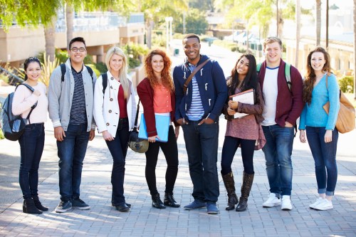 Portrait Of University Students Outdoors On Campus